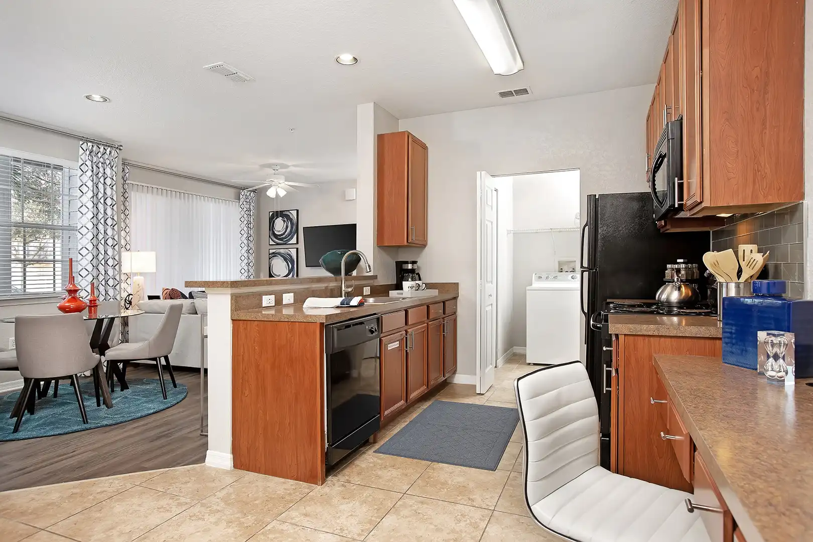 Kitchen with built in desk and attached washer/dryer closet