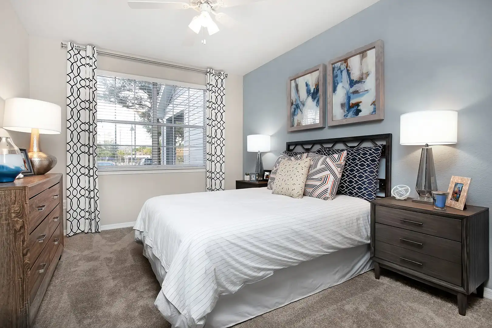 bedroom with queen bed and two side tables