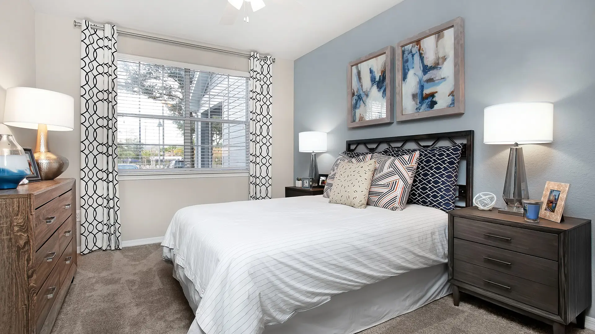 bedroom with queen bed and two side tables